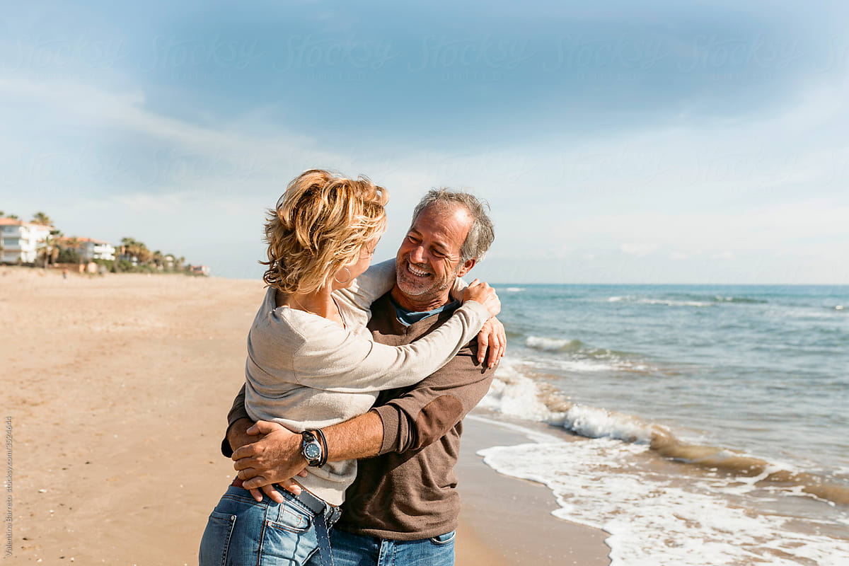 Mature couple hugging  at the beach