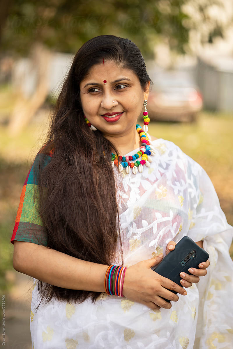 Indian middle aged woman with traditional Indian dress Sari at outdoors
