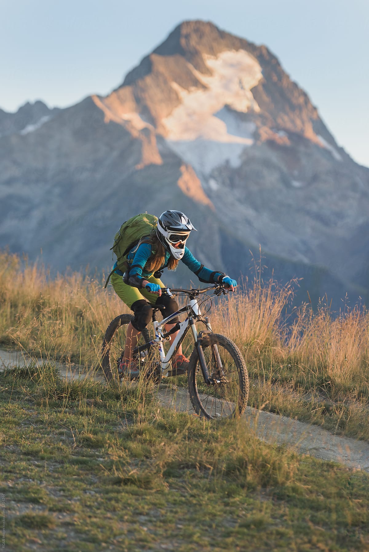 Portrait of woman riding mountain bike in the French Alps