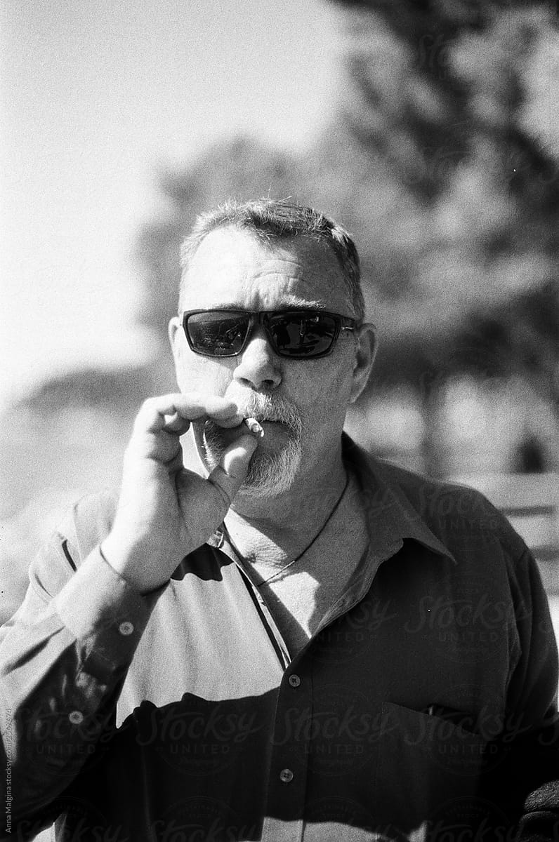 A beautiful middle age man portrait smoking