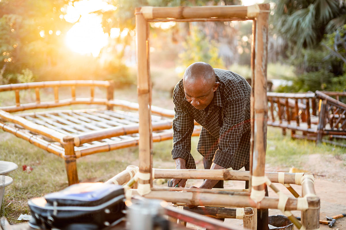 Man making wood furniture in countryside