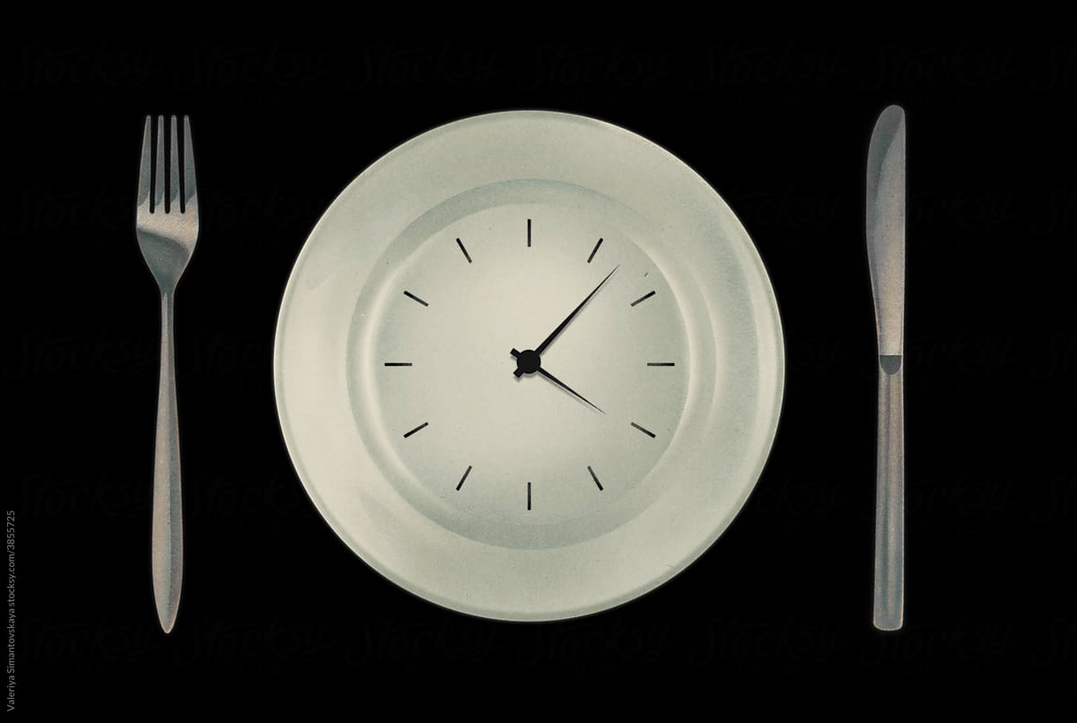 Watch on a plate with cutlery