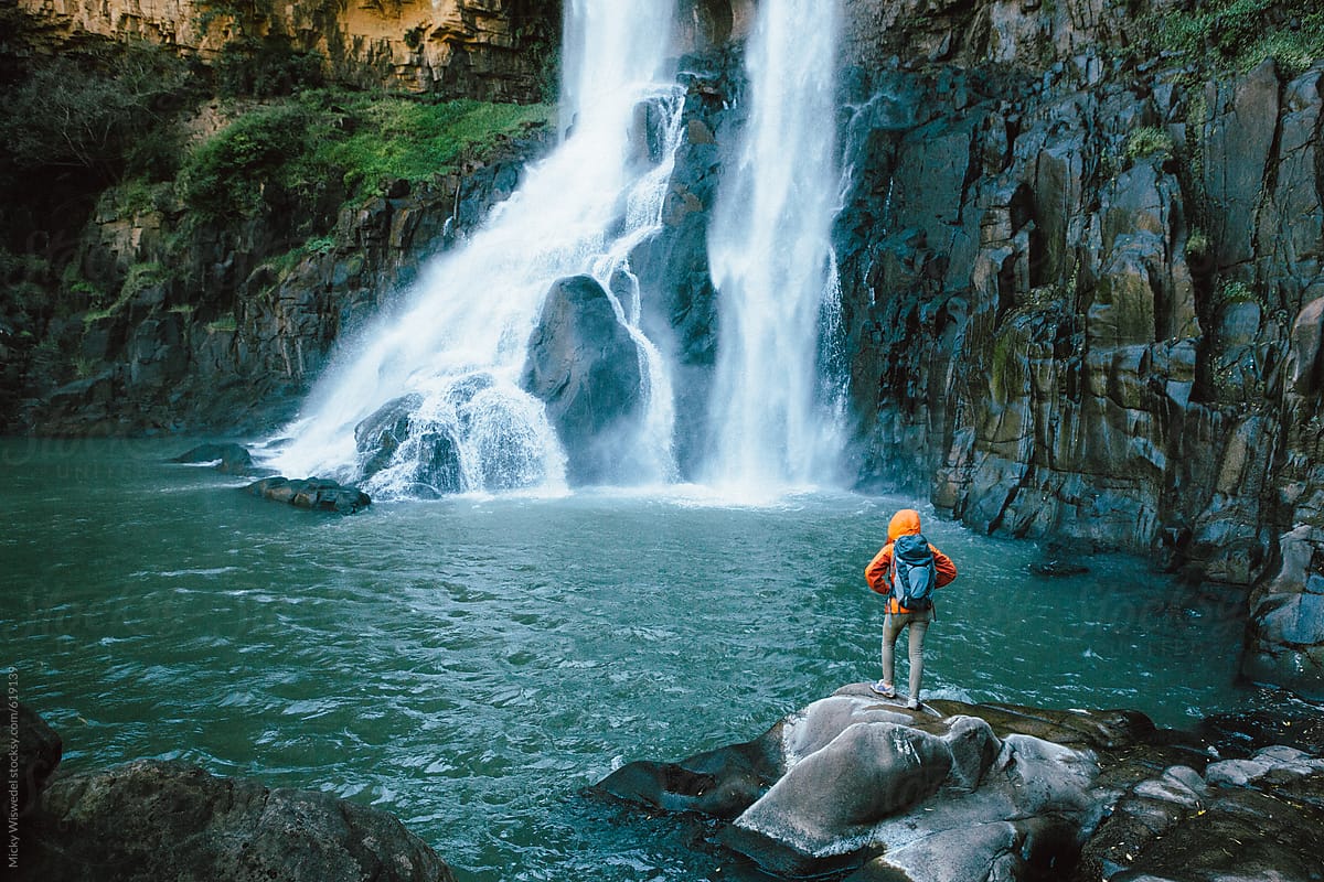 Hiker and waterfall