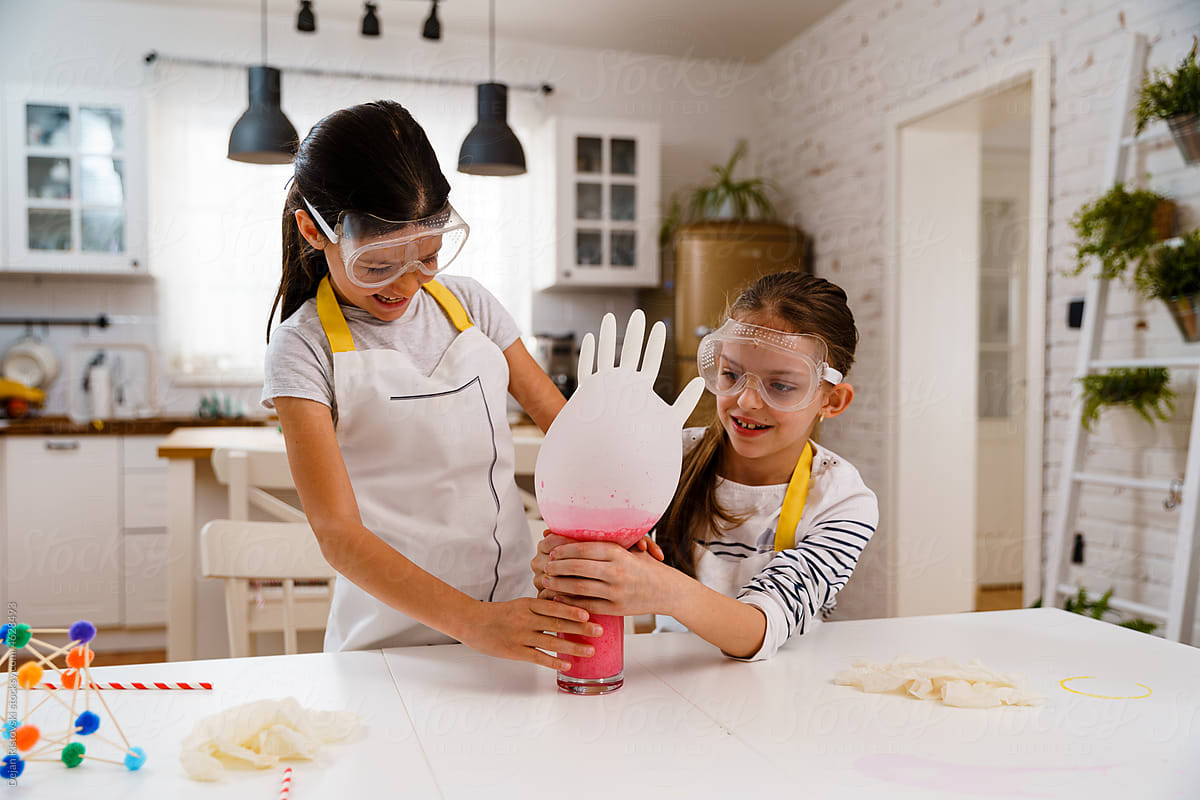 Children doing experiments and having fun in the kitchen