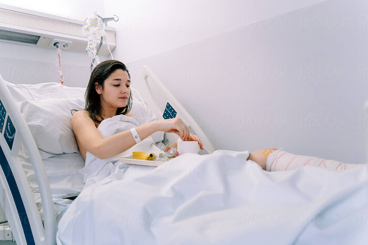 Female Patient Having A Meal In The Hospital.