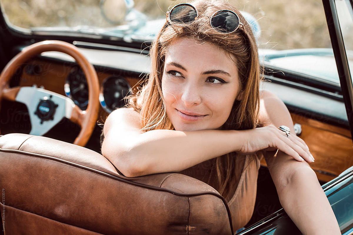 stylish girl with a car stock photos - OFFSET