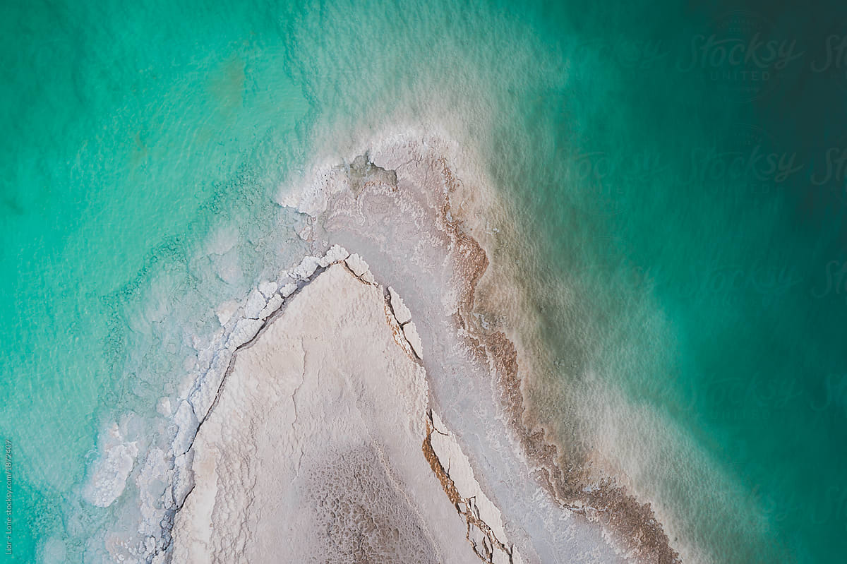 Aerial shot of salt formation penetrating the dead sea. Israel
