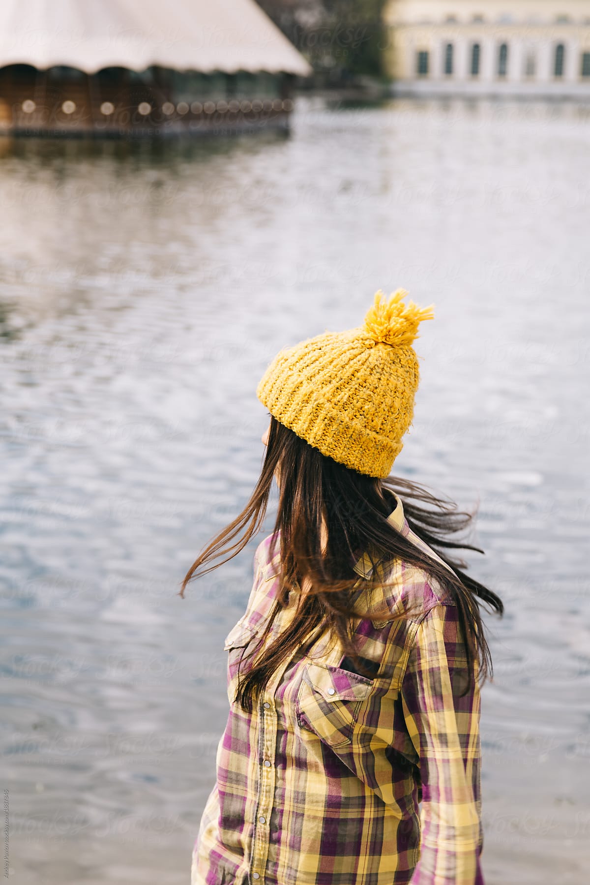 Woman walking in a yellow hat