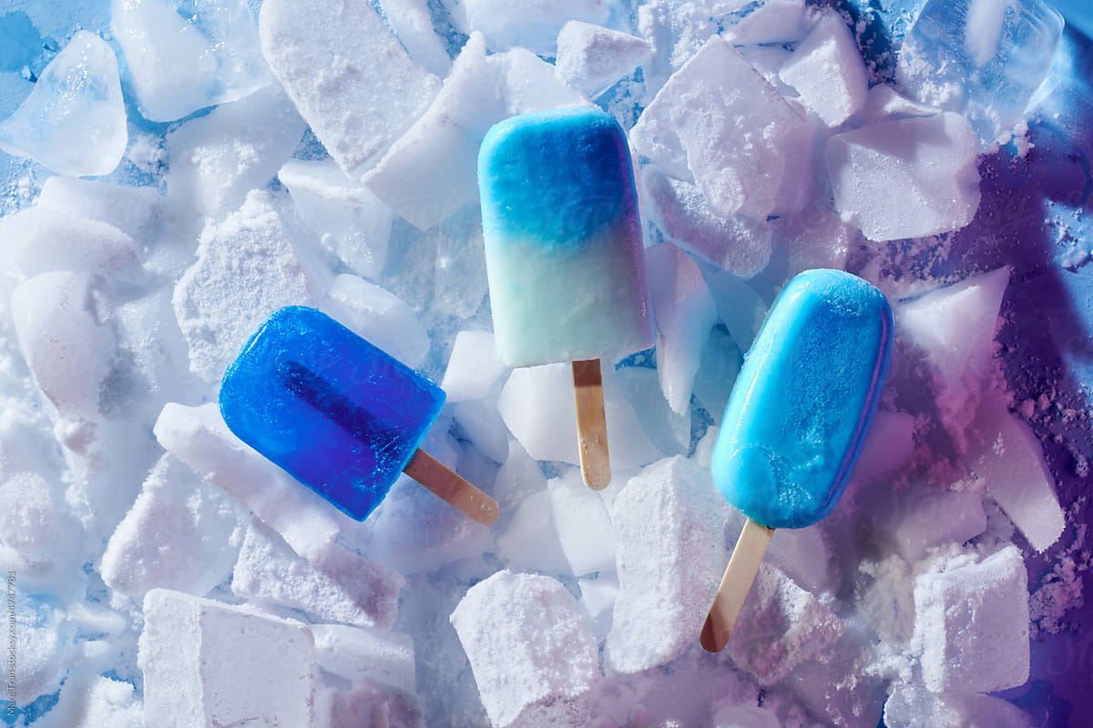 refreshing fruit popsicle lollies on ice background
