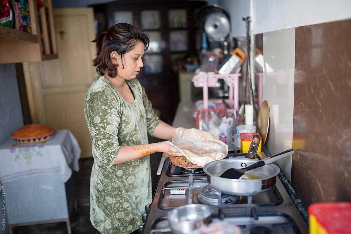 Woman cooking Christmas cake, Pakistan