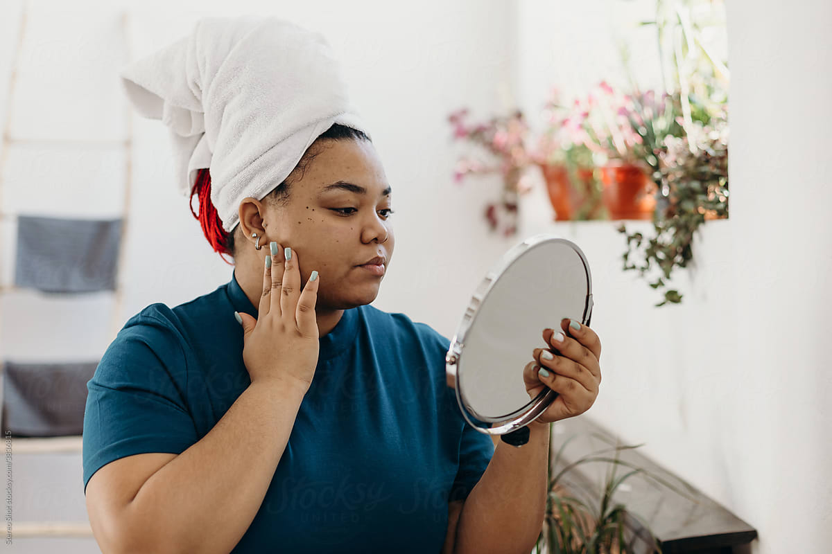 Curvy woman doing beauty routine in morning at home