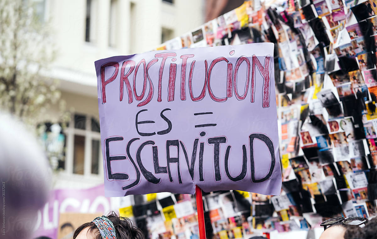 Women March Spanish Protest Signs On The Streets.