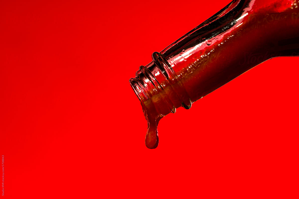 Hot Sauce on a Red Background