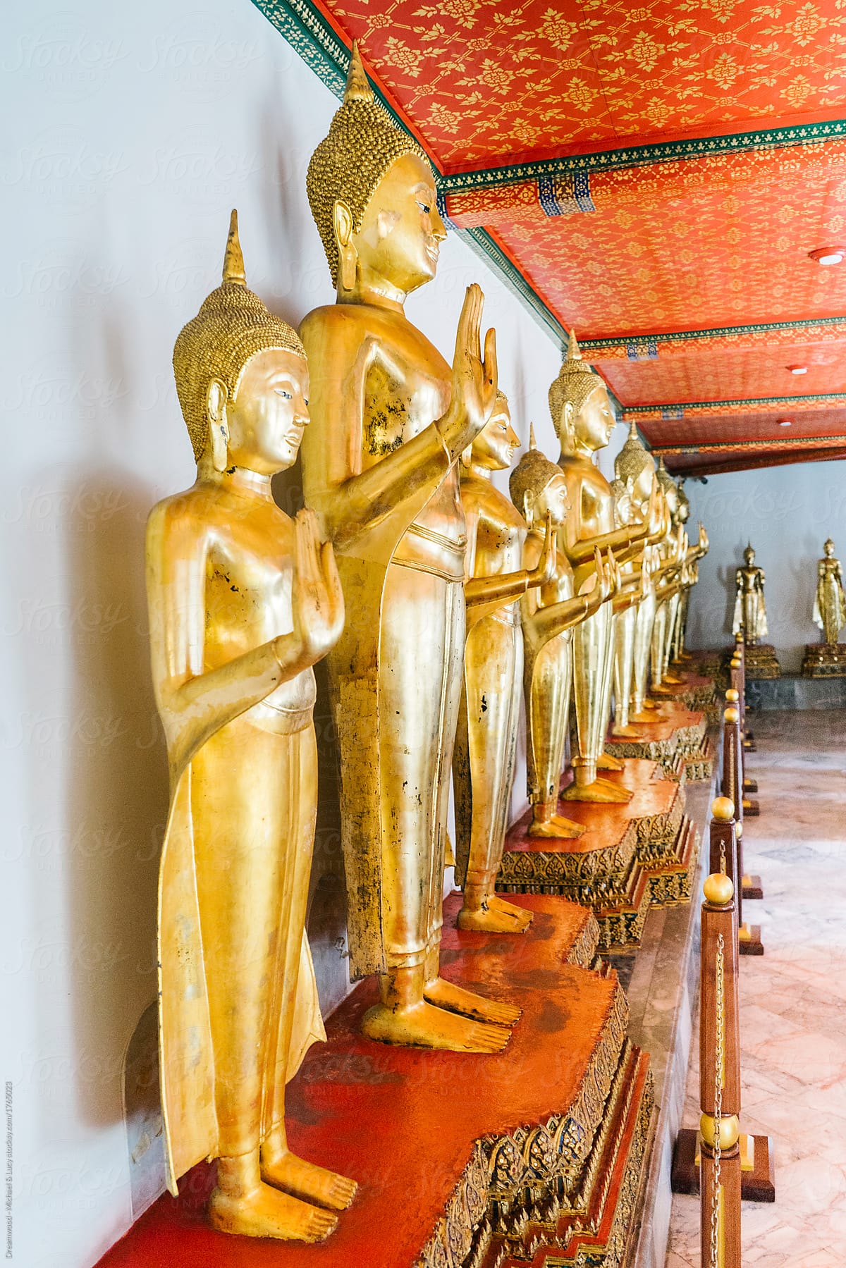 Arranged row of golden statues in temple