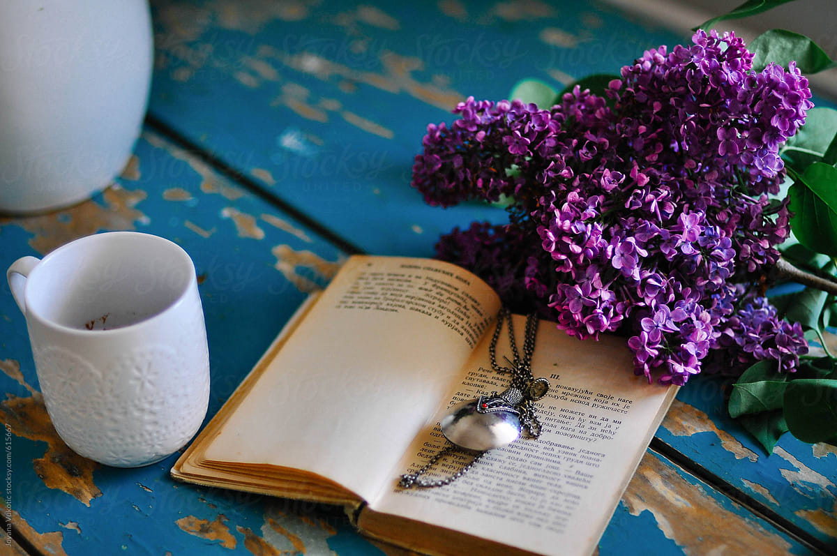 Flowers, coffee and book on the table