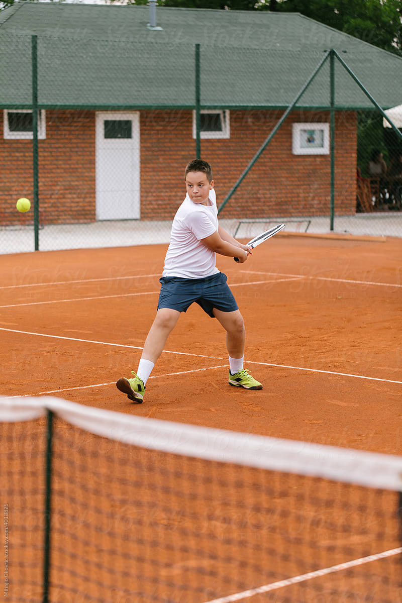 Boy Competing In Tennis