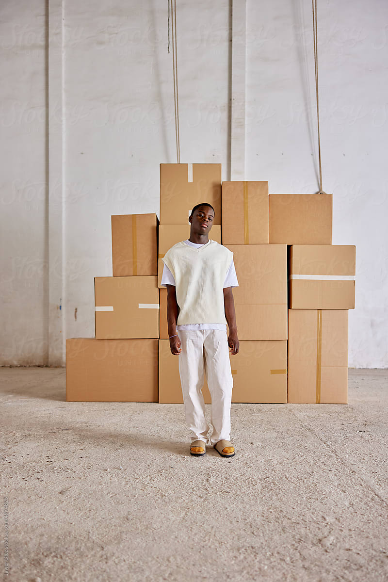 Storehouse worker near boxes