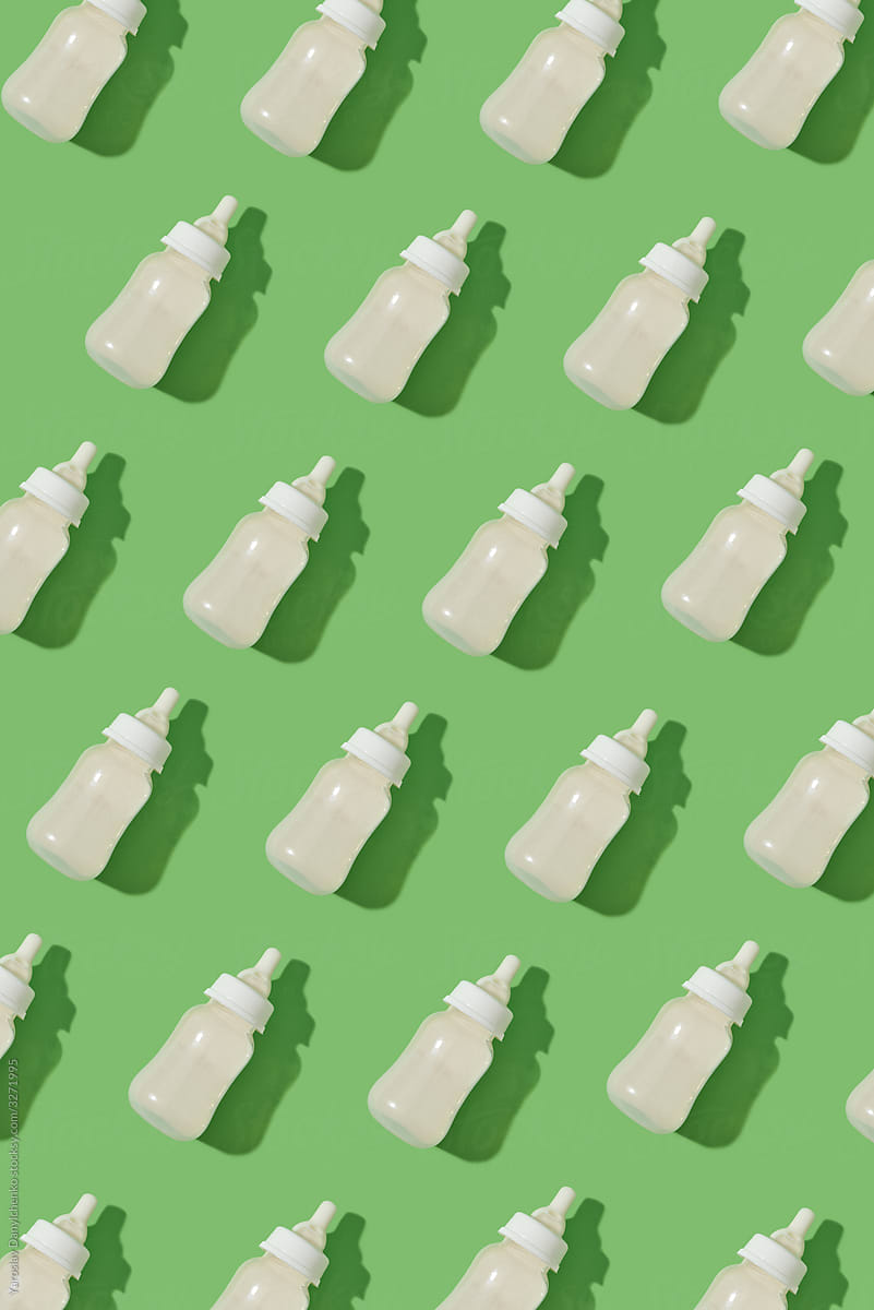 Baby plastic milk bottles pattern with shadows.
