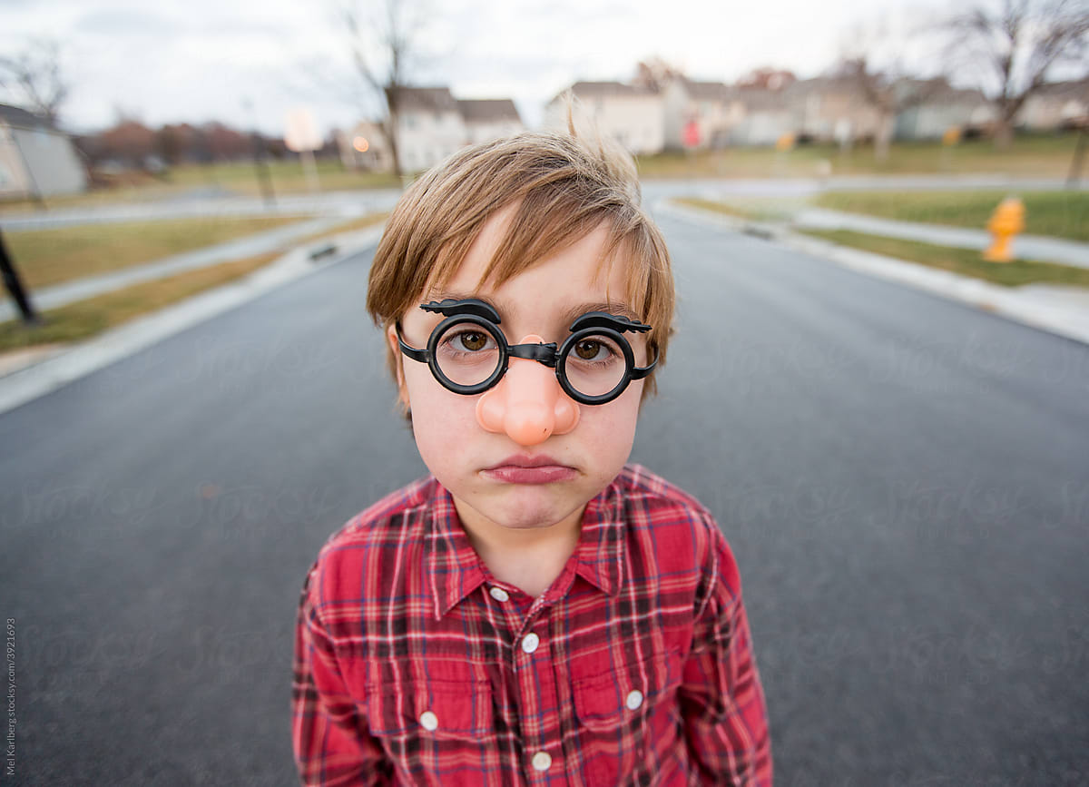 Young boy in funny plastic glasses