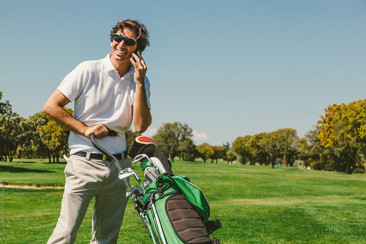Golf Player in a Golf Course Talking by Phone