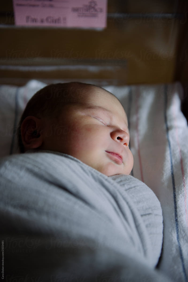 Newborn Baby Sleeps in Hospital Crib