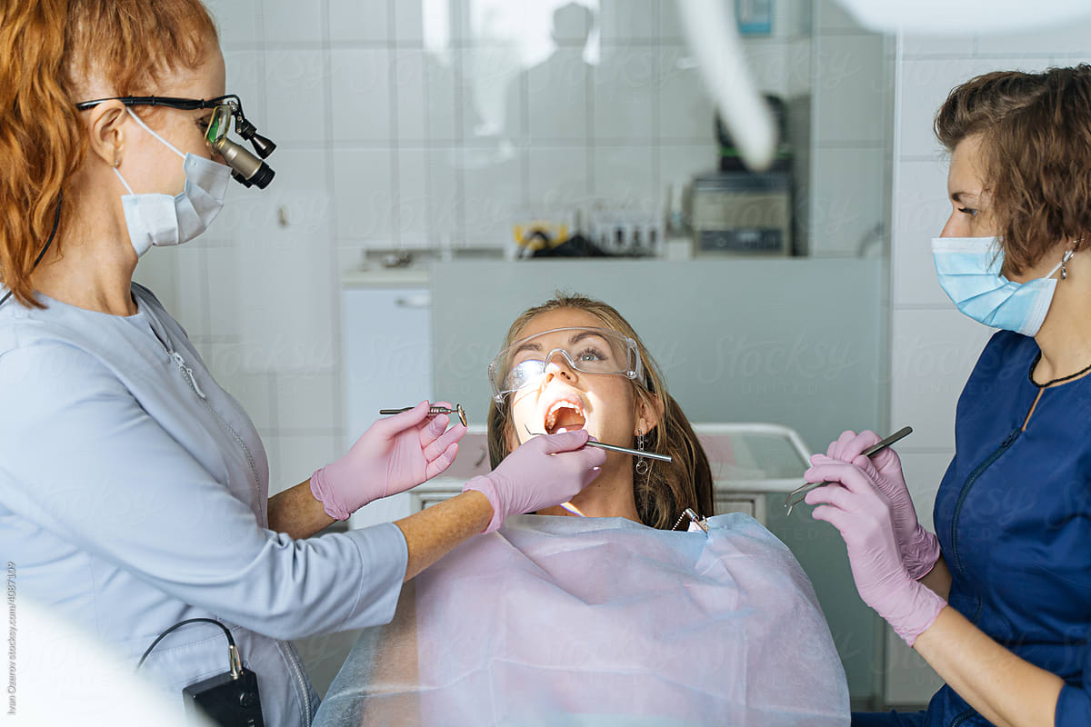 Woman having teeth treatment