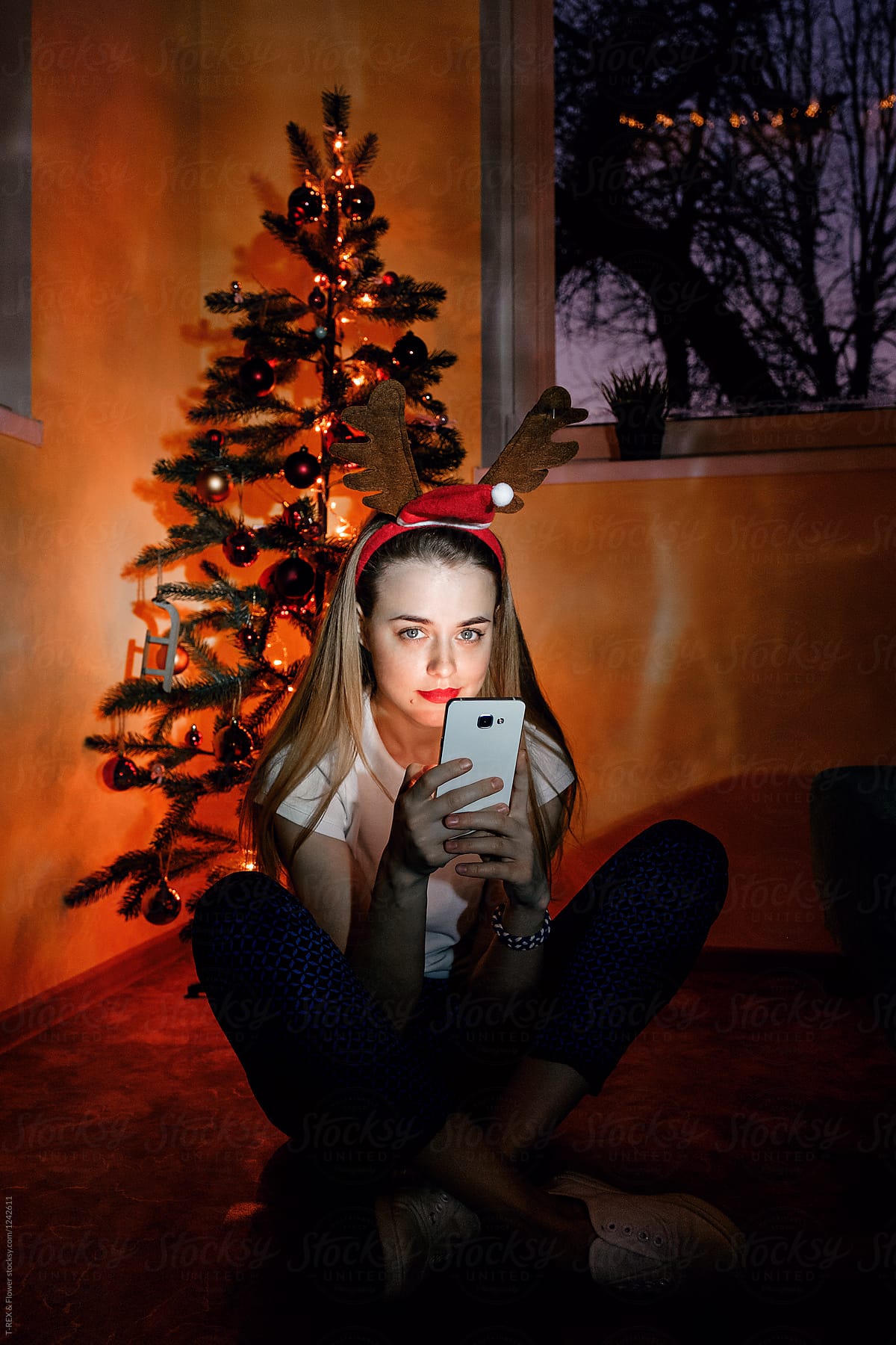 Girl With Phone Looking At Camera By Stocksy Contributor Danil Nevsky Stocksy