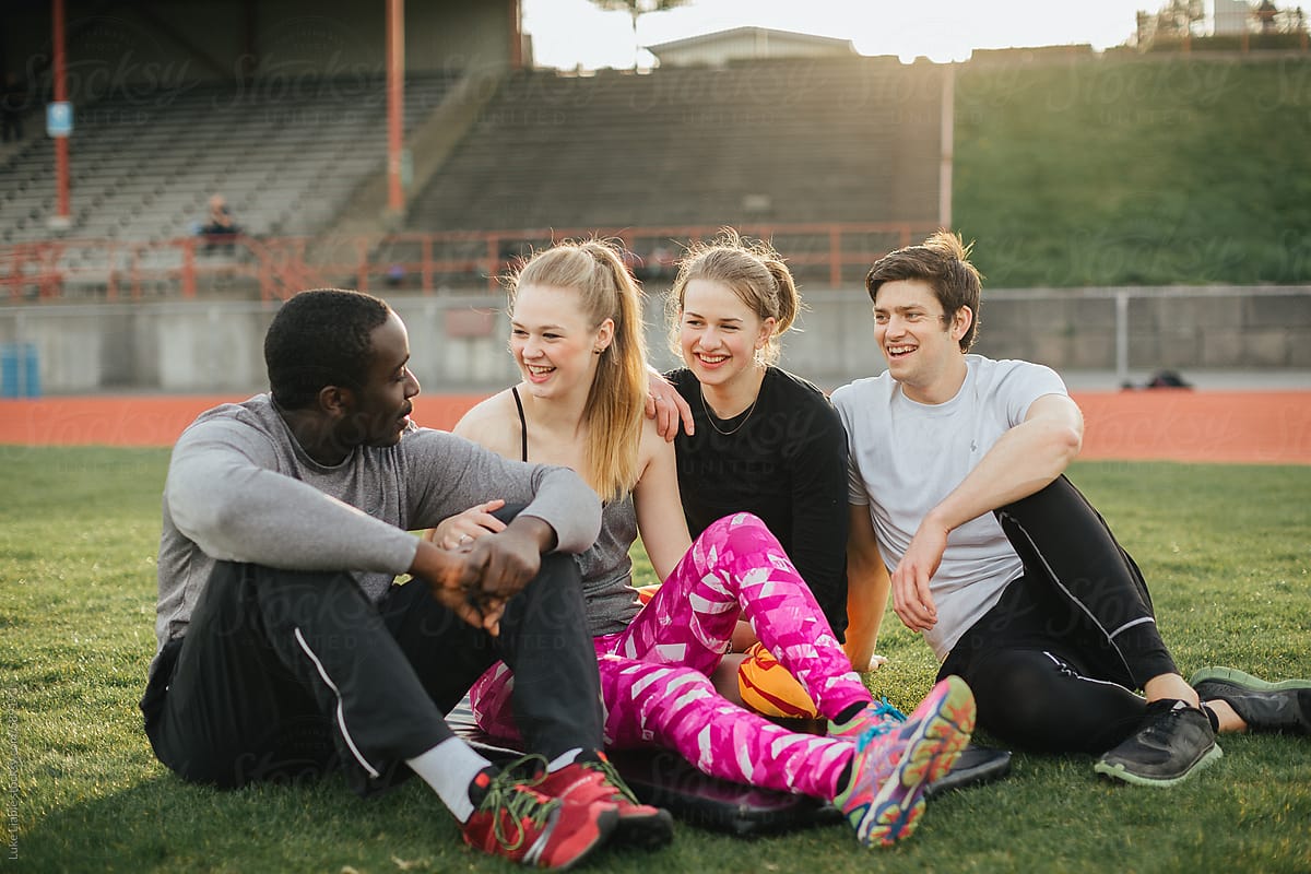 Young multi ethnic fitness group laughing