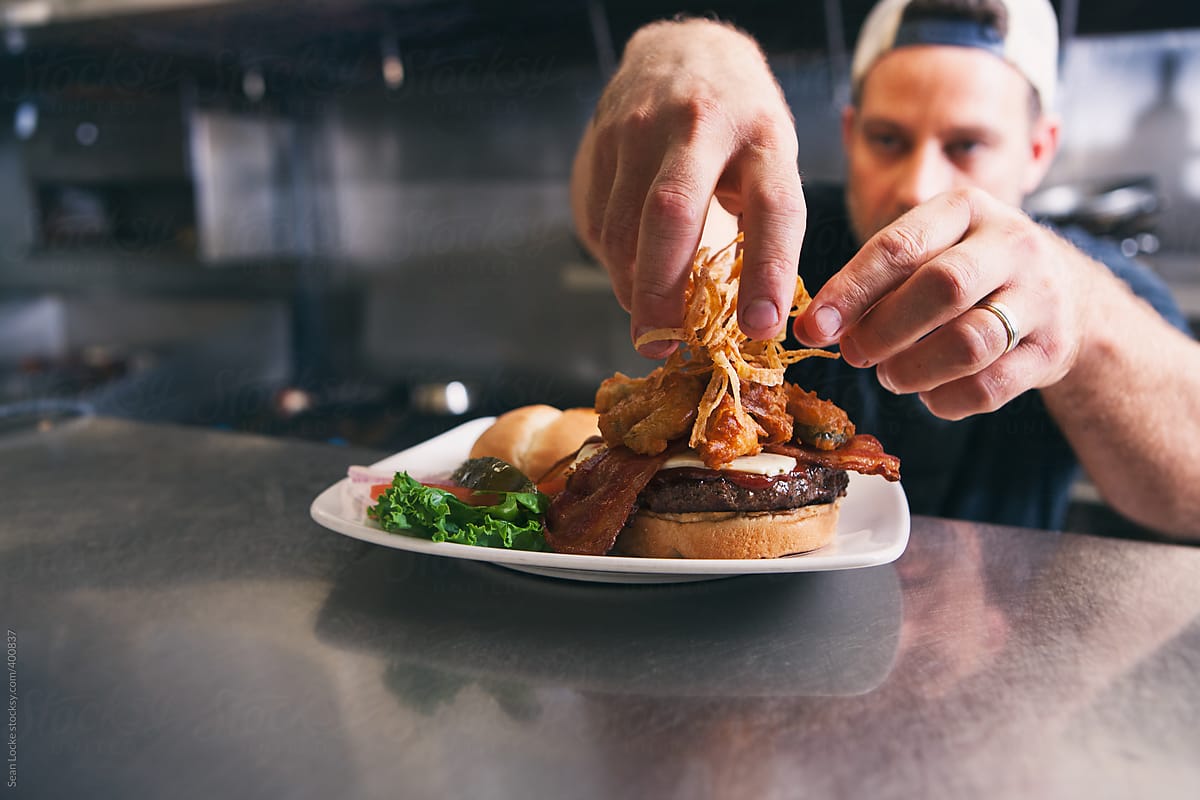 Kitchen: Chef Puts Onions Straws Onto Bacon Cheese Burger