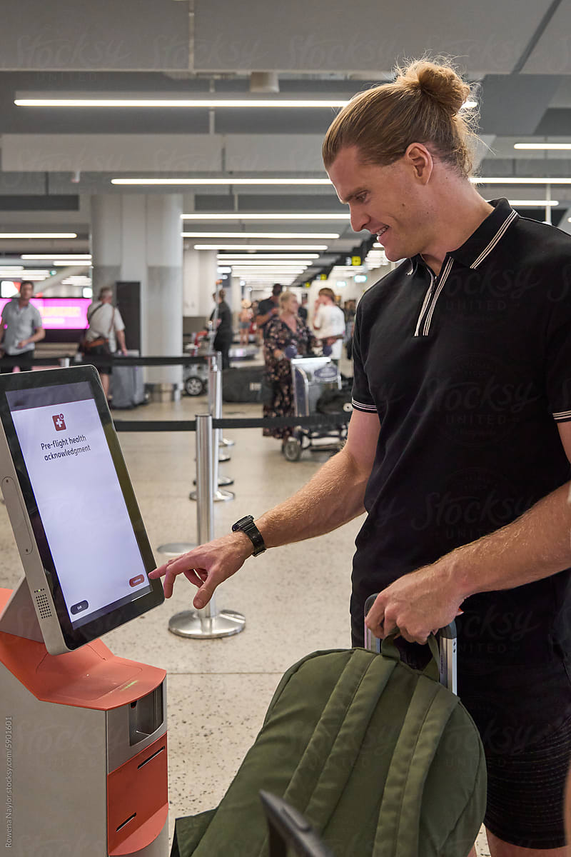 Man doing self check-in at airport