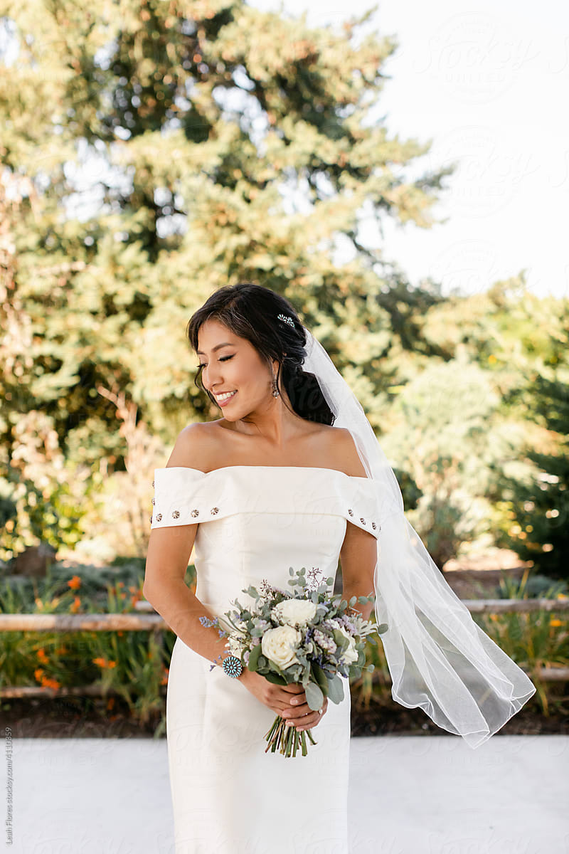Beautiful, Smiling Bride Holding Bouquet