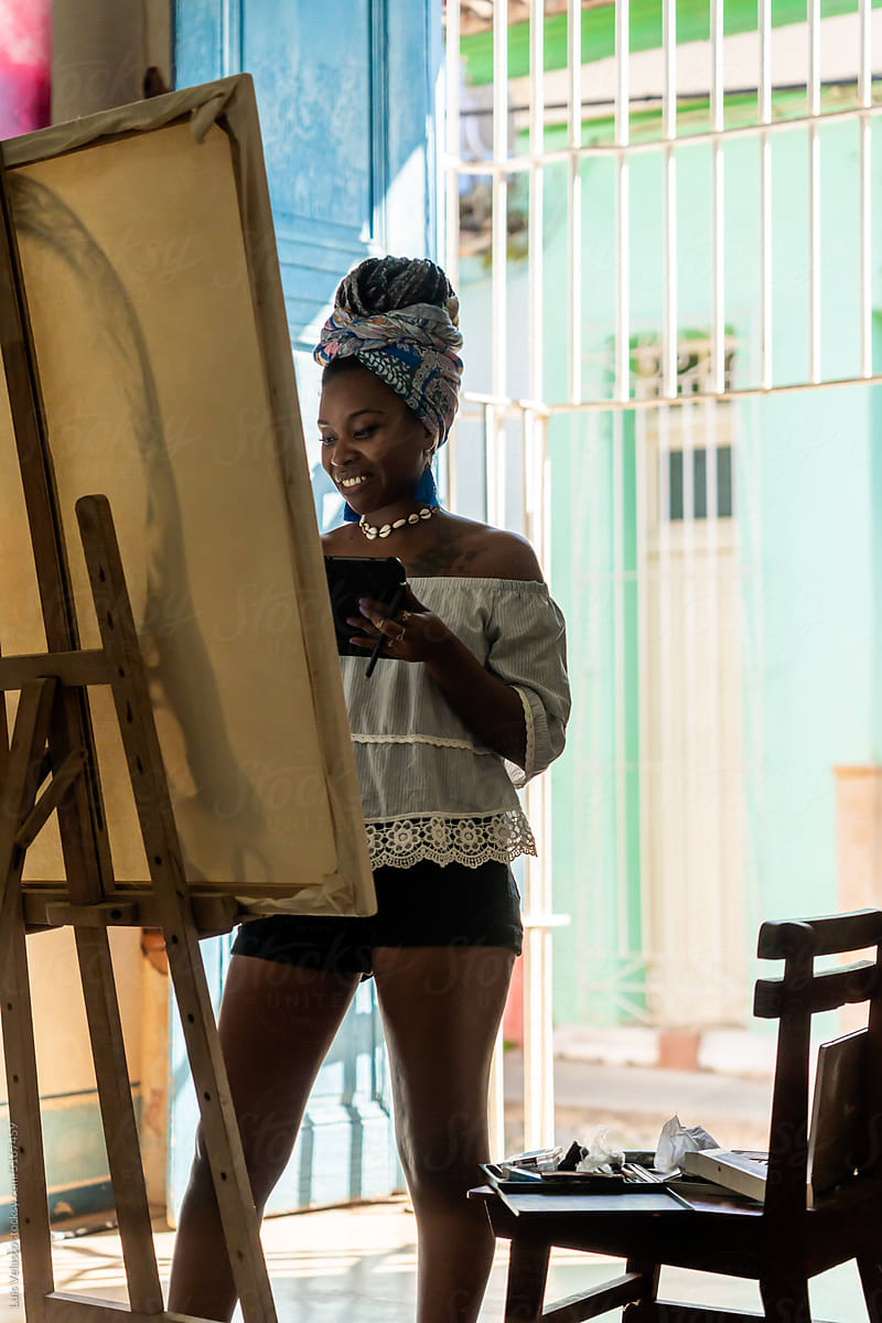 Cuban Painter Creates A Painting In Her Art Studio