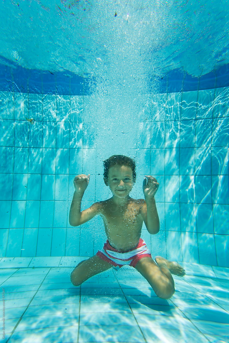Boy Smiling Under Water By Stocksy Contributor Dejan Ristovski