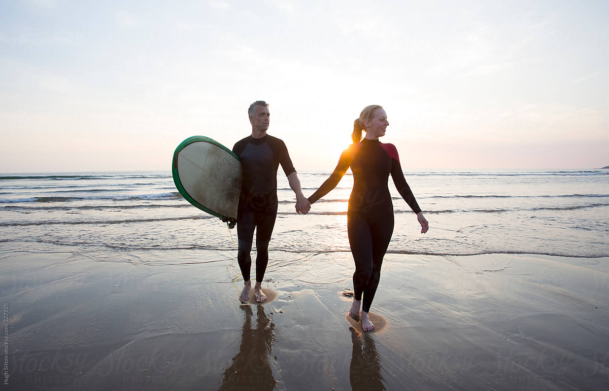 Surf Couple At Beach By Stocksy Contributor Hugh Sitton Stocksy 9230