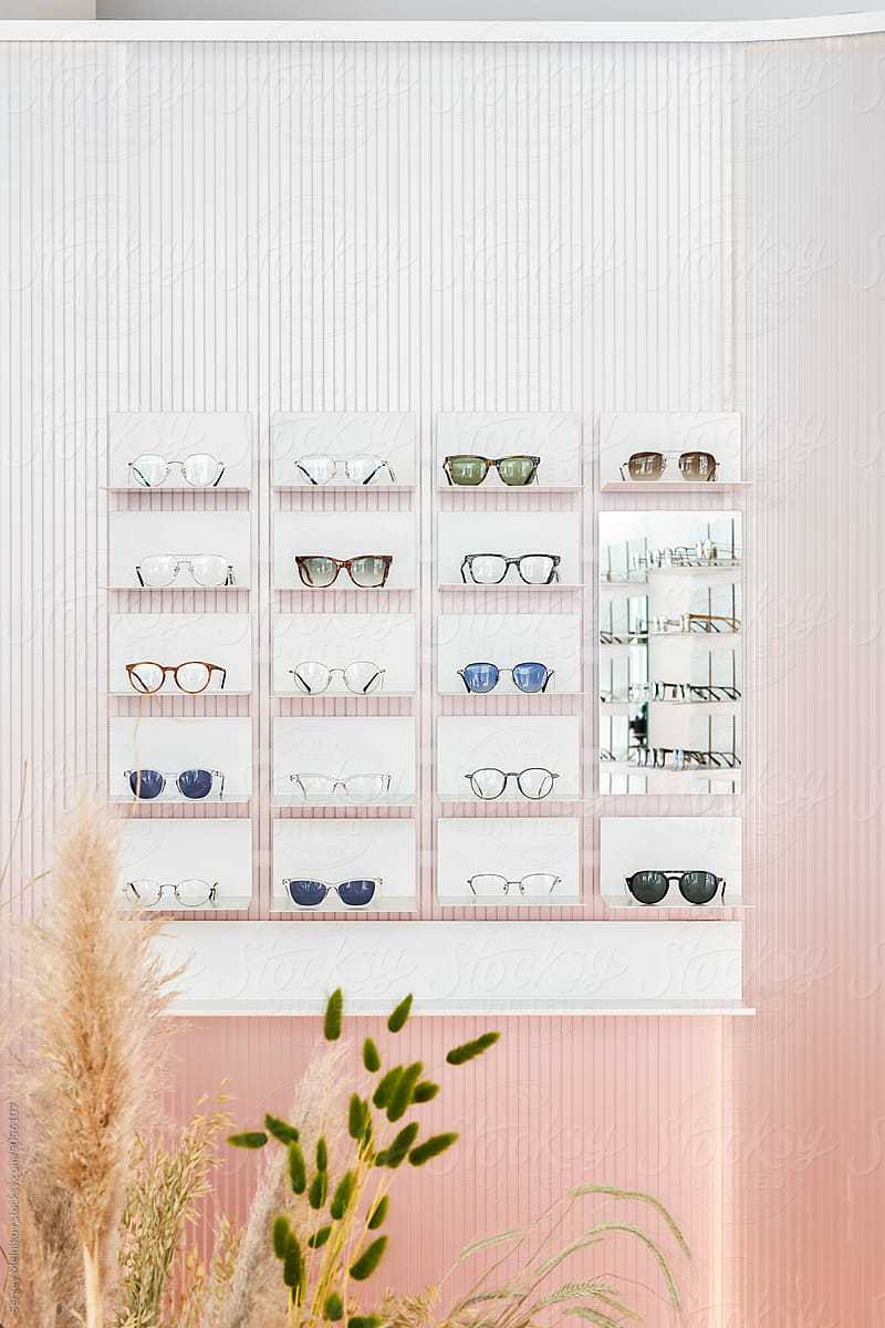Wall rack of sunglasses in store