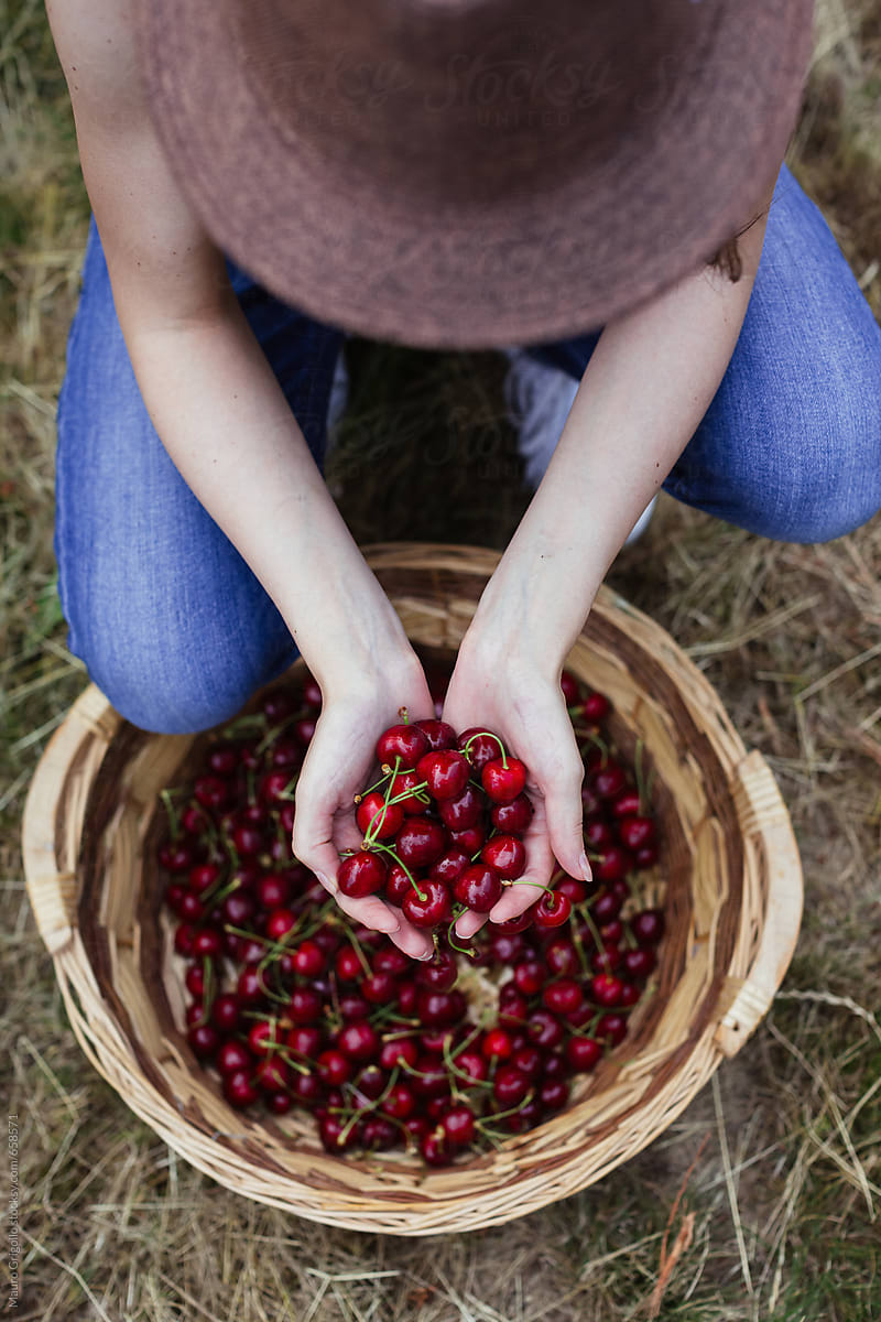 Woman holding cherries