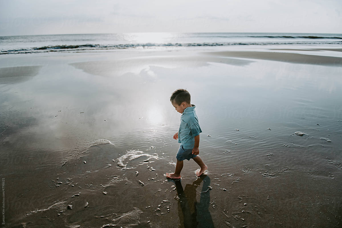 A Boy Walking on the Beach