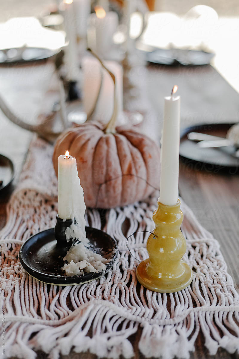 fall candles and pumpkins on outdoor table