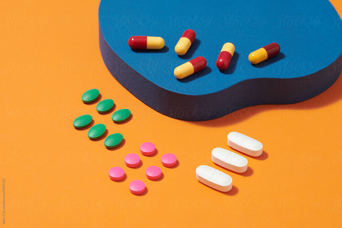 Colorful vitamin pills, capsules and medicine ampoules