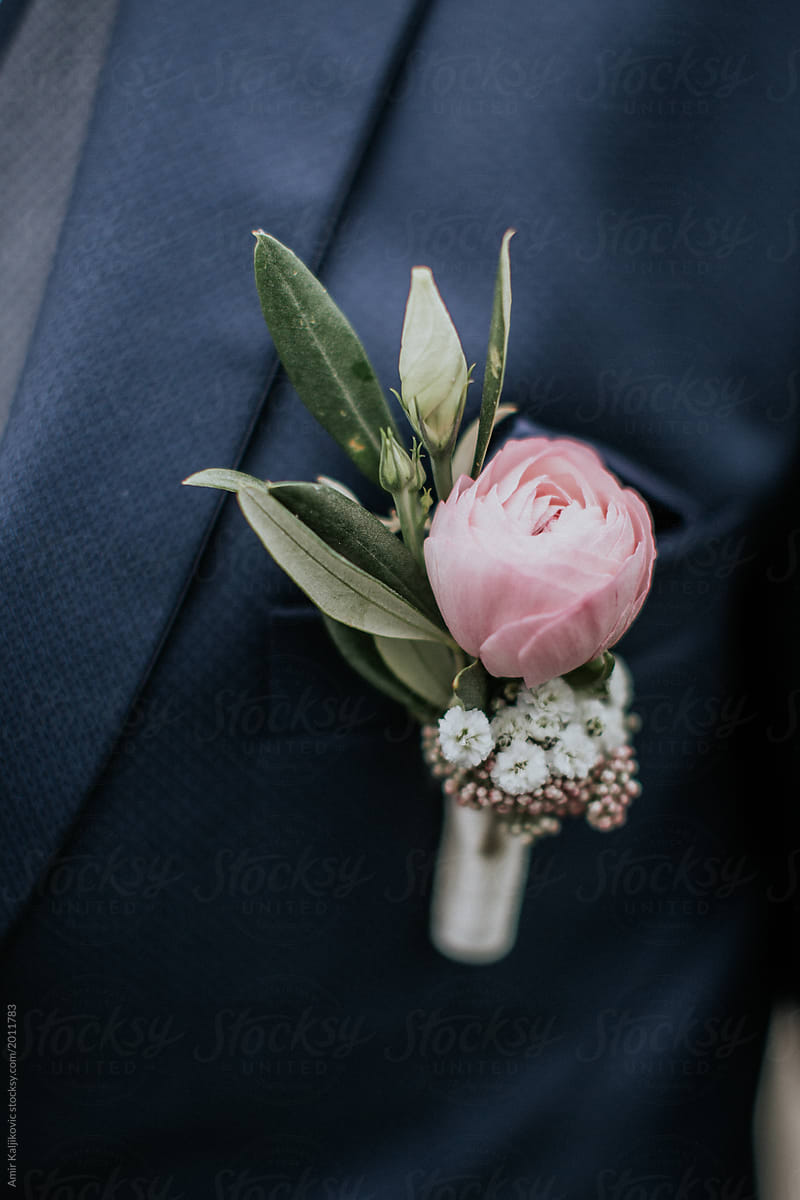 Groom or Best Man wearing a floral corsage