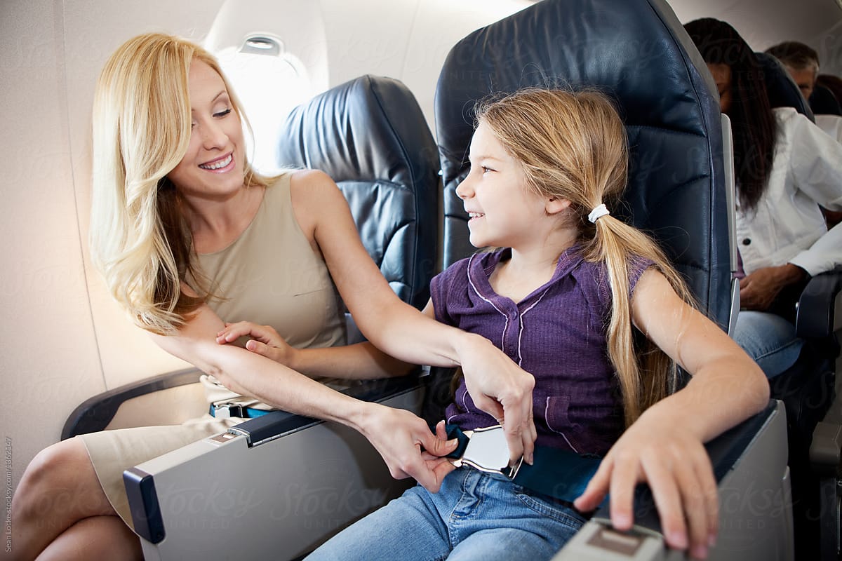 Airplane: Mother Helps Child With Seatbelt