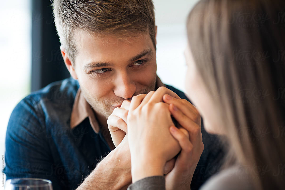 Man Kissing His Girlfriend S Hand By Stocksy Contributor Lumina Stocksy