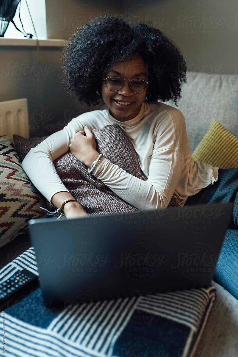 Afro Woman is Working from Home with a PC
