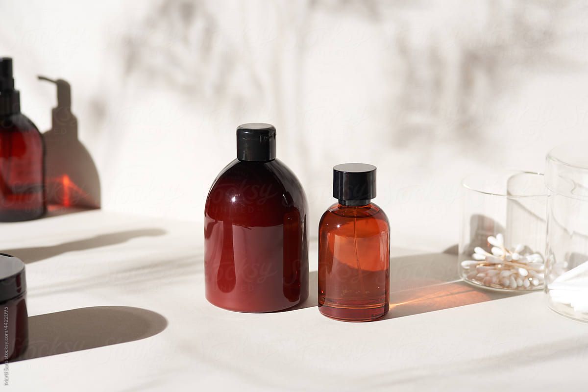 Bottles with cosmetic products in bathroom