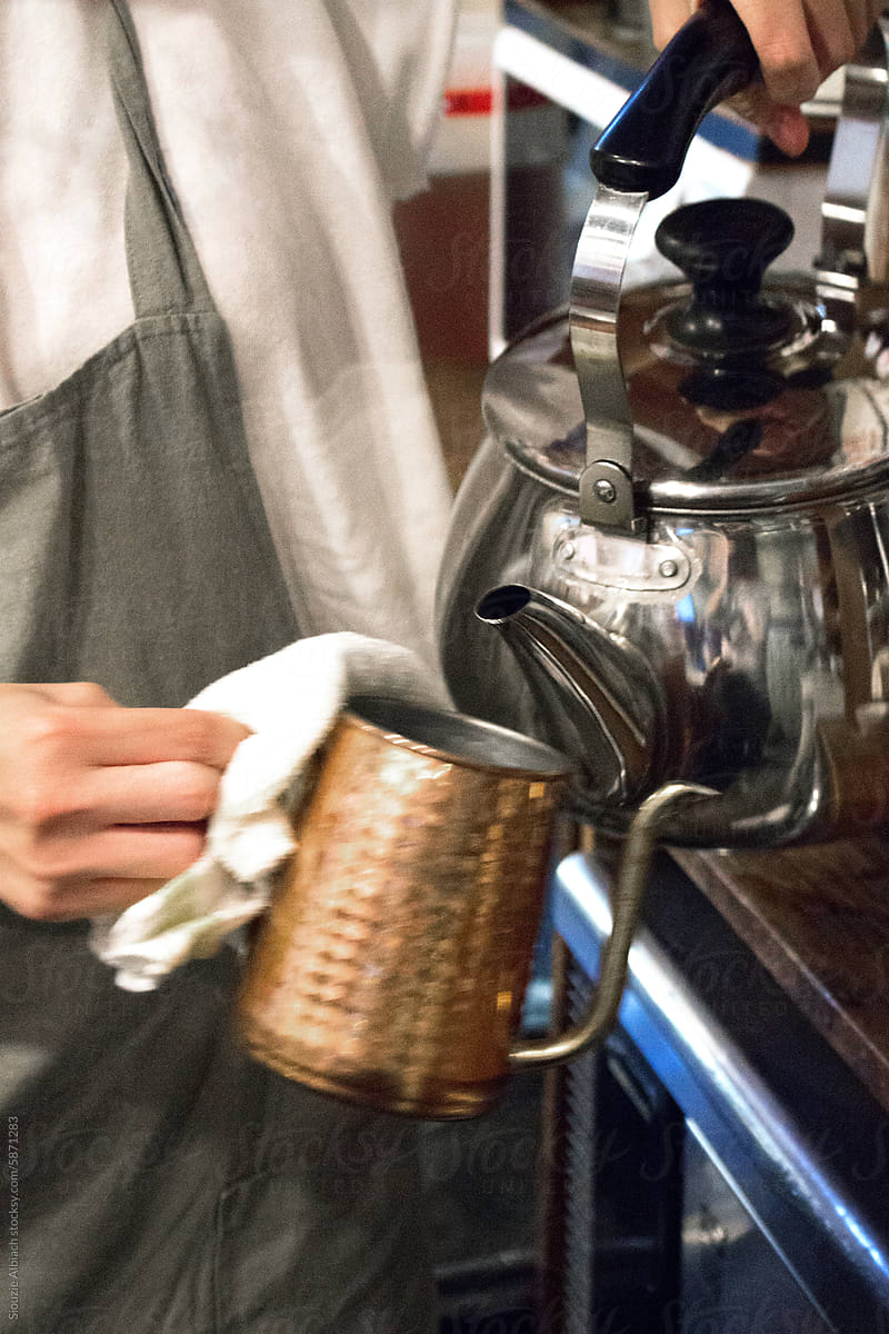 Barista making a hand drip coffee in a Japanese coffee shop in Kyoto