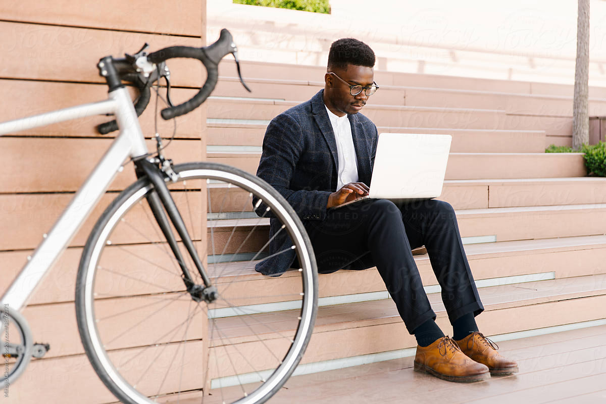 Young Businessman Using Laptop Outdoors