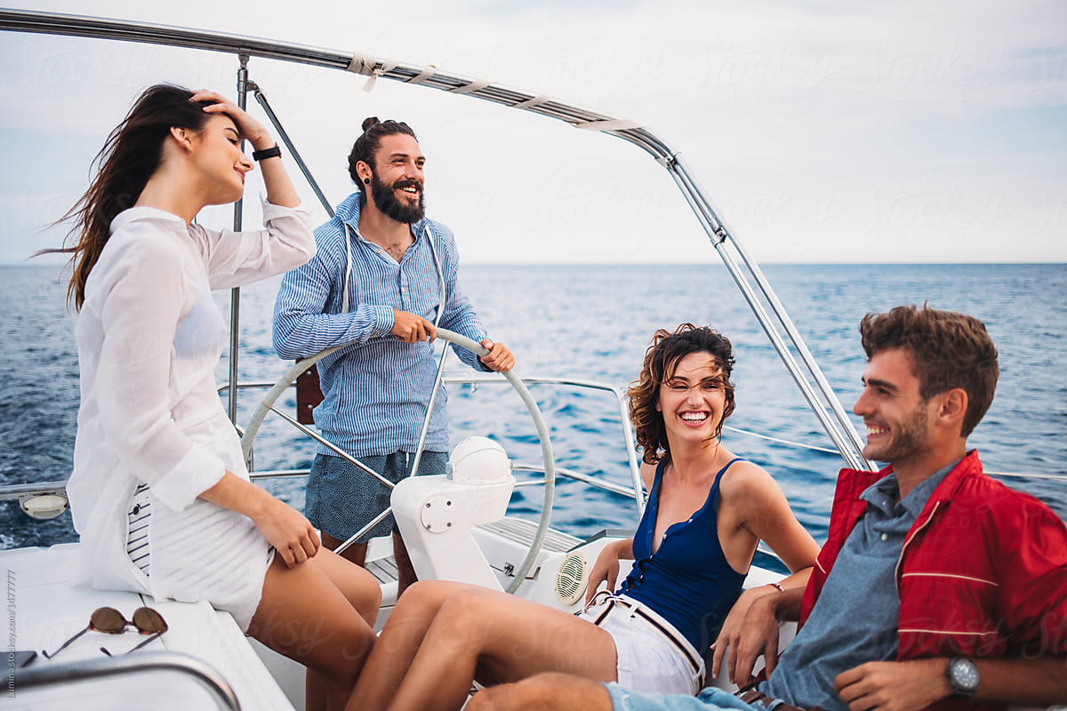 Friends Enjoying Summer Vacation on Sailing Boat