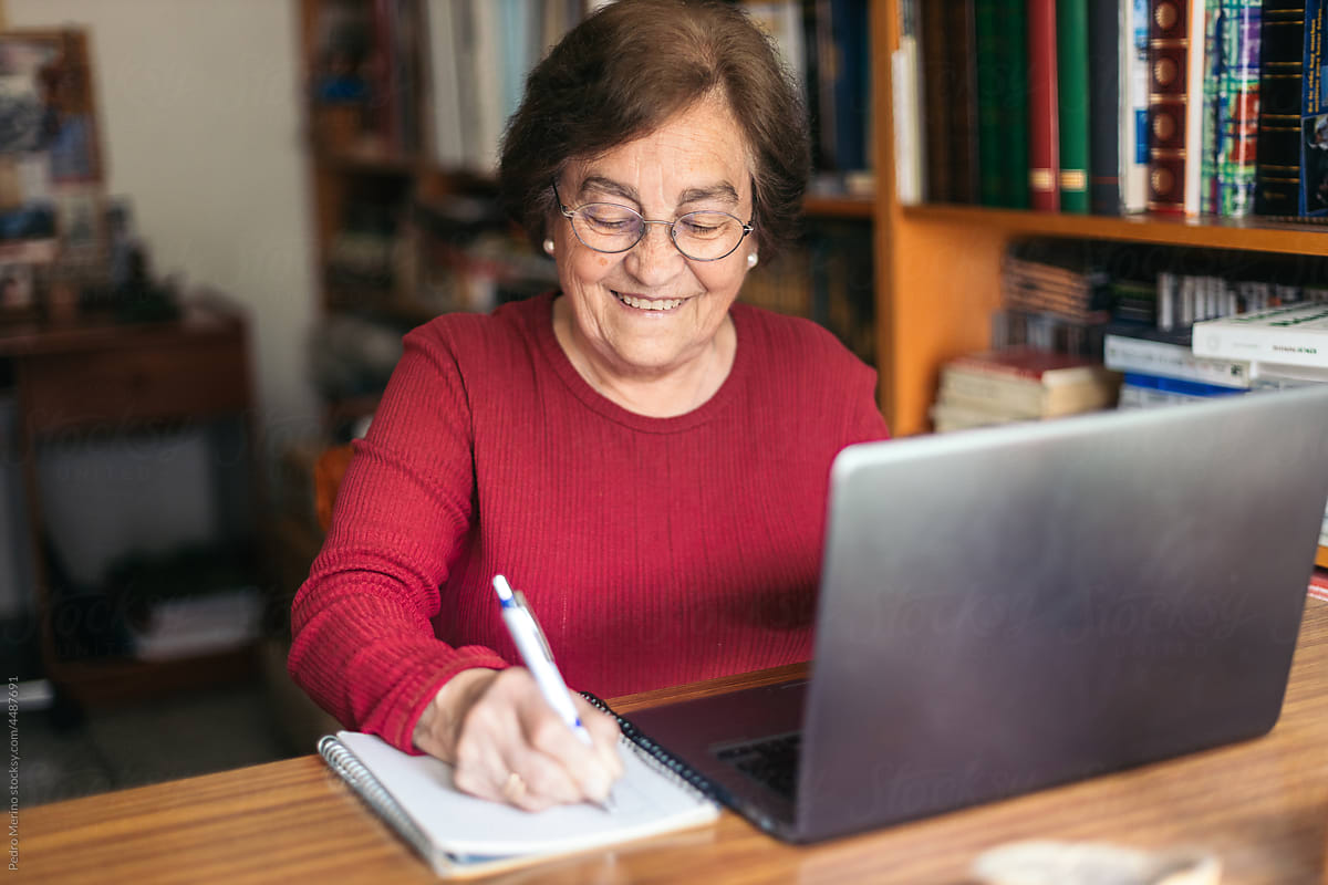 Old woman using laptop