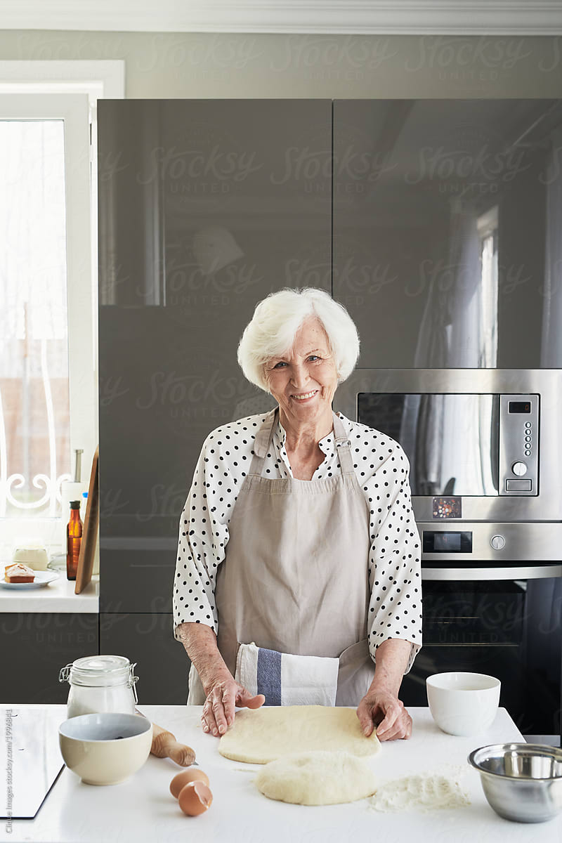 Happy Elderly Woman In Kitchen