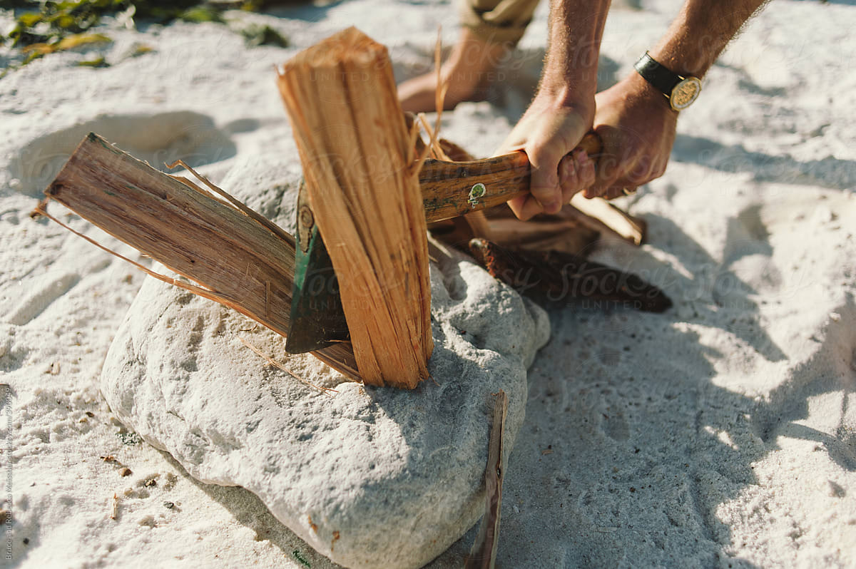 Chopping wood on the beach